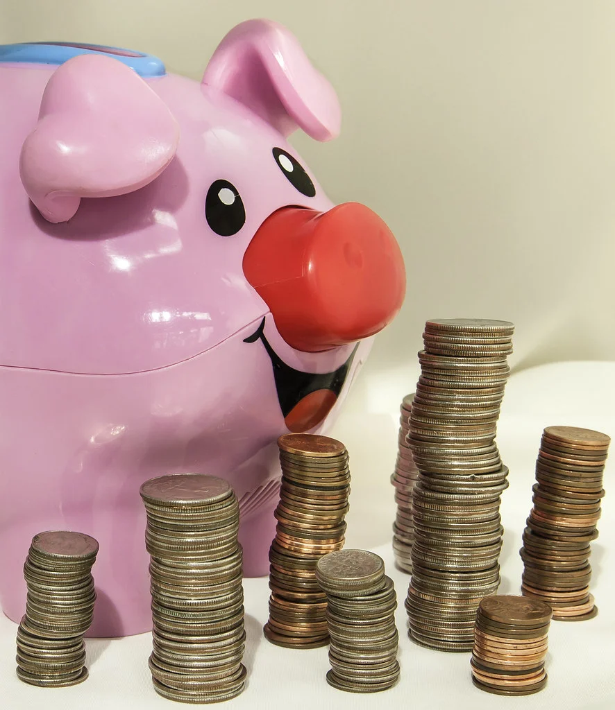 Stack of coins and banknotes illustrating a salary calculation